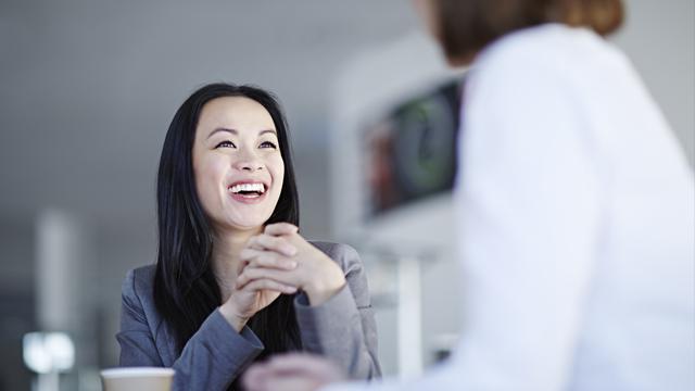 a woman receives news of Emsculpt NEO from a doctor in Germantown