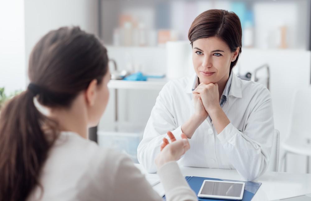 a woman speaks with her doctor about weight loss injections in Collierville, TN