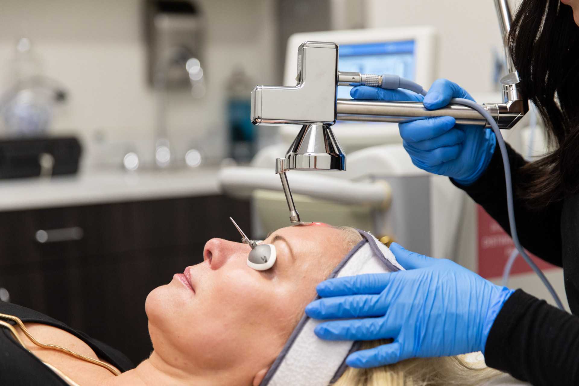 A woman getting Hyperpigmentation Treatment in Memphis
on her face